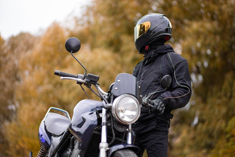 Photo Man Next To Motorcycle