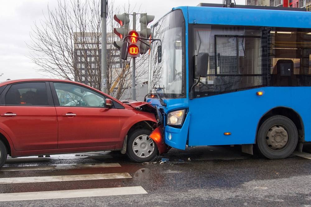 Photo of bus and car