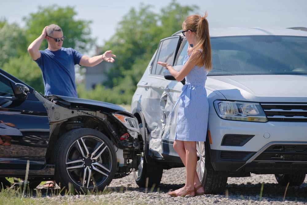 Photo of people at the car accident