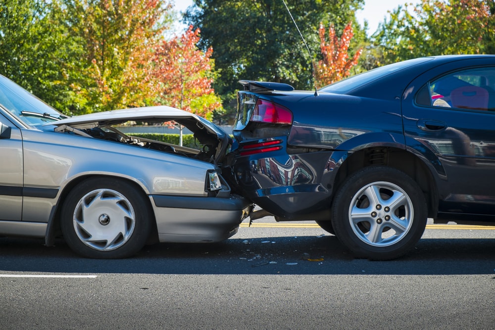 Rear-End car accident involving silver and black car