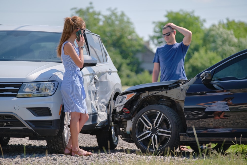 Drivers gathering to look at damage after a t-bone car accident